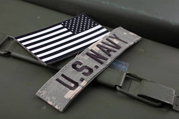 istock U.S. Navy Branch Tape with national US flag patch on green ammo can 1483695344