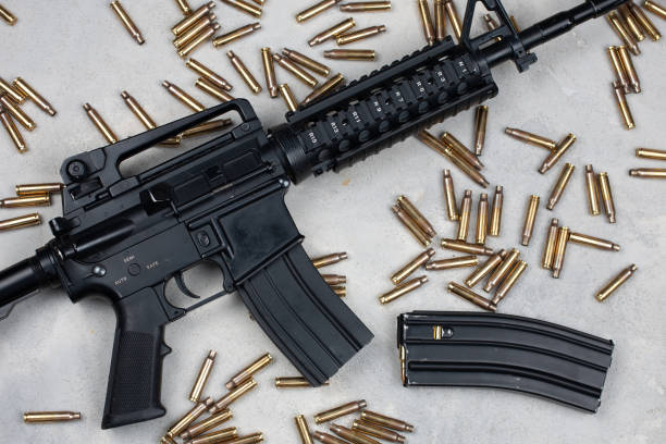 istock M4 carbine and 5.56mm shells and magazine with bullets 1483695607