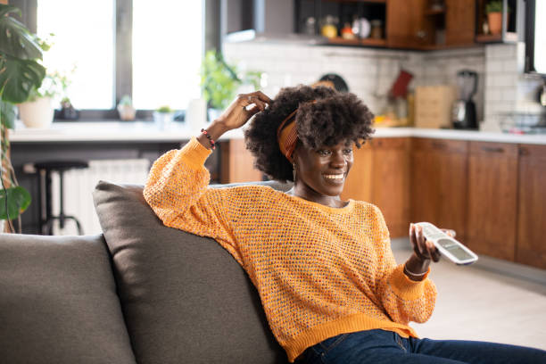 istock Woman watching TV in the room 1483700384