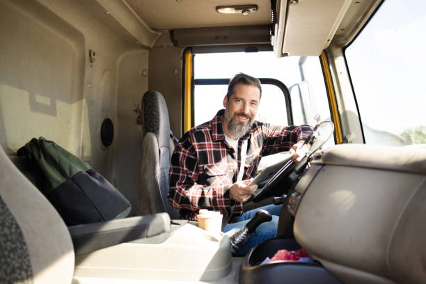 istock Truck driver checking his route before starting to drive 1483700559