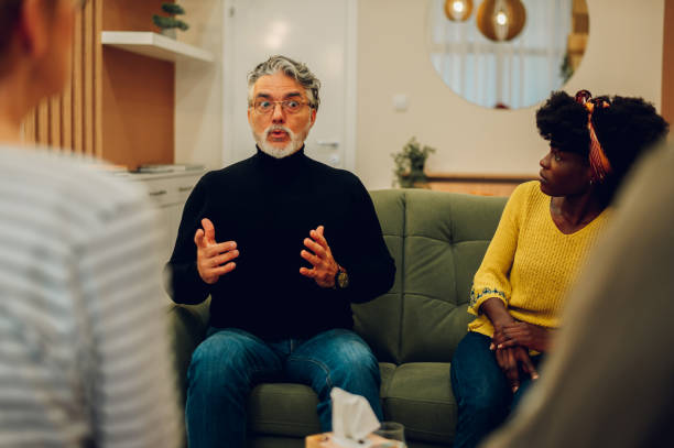 istock Senior man talking about his mental health on a group therapy session 1483701090