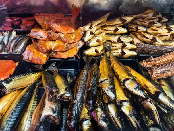 Assortment of Smoked Fish Available at the Shop Assortment of Smoked Fish Available at the Shop kipper stock pictures, royalty-free photos & images