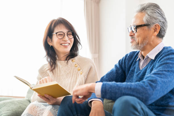 istock senior age couple reading a book 1483702612