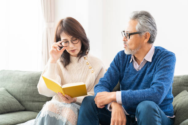 istock senior age couple reading a book 1483702692