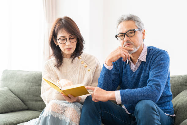 istock senior age couple reading a book 1483702741