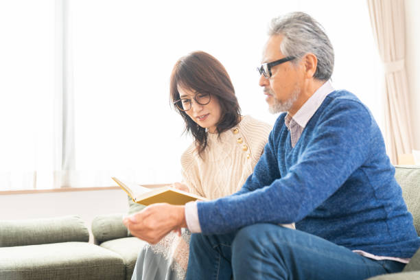istock senior age couple reading a book 1483702765