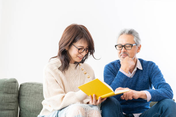 istock senior age couple reading a book 1483702915