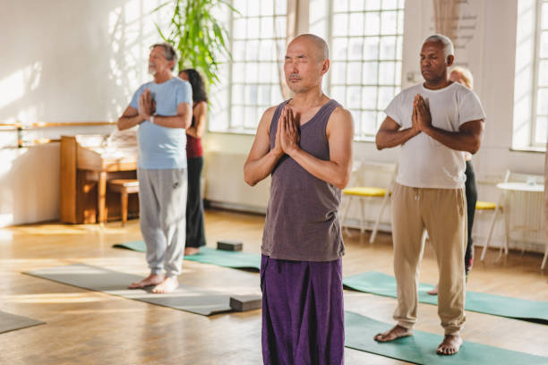 istock Yoga Participants Following Instructions And Postures During Class 1483707923