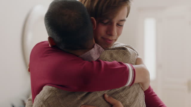 teenage boy hugging father congratulating son successful achievement excited dad feeling proud parent enjoyinf family connection 4k