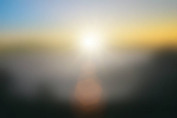 istock Natural background blurring warm colors and bright sun light. Bokeh or Christmas background Green Energy at sky sunny color orange light patterns plain abstract flare evening clouds blur. 1483719622