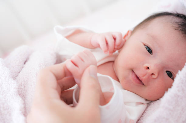istock Cute japanese baby with mother 1483722739