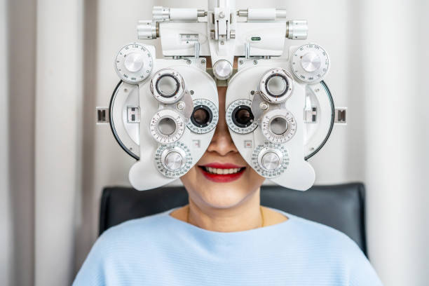 istock Smiling senior woman asian doing eye test on optical phoropter, checking on her eye with optometry machine 1483728661
