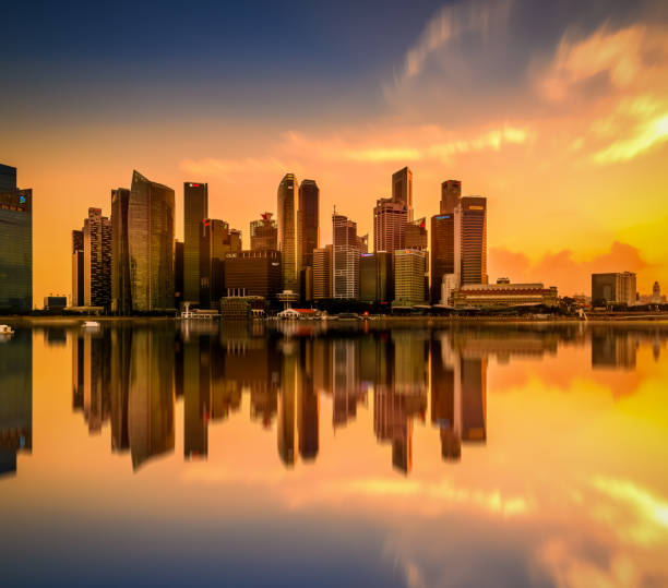 istock Vibrant sunset panorama background of central business district with perfect reflection 1483729676