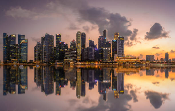 istock Vibrant sunset panorama background of central business district with perfect reflection 1483729698