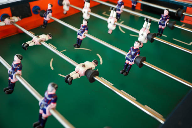 istock A foosball table is a recreational game symbolizing entertainment, skill, and socializing. It represents teamwork, competition, and the joy of play, and is often associated with bar and culture 1483731000