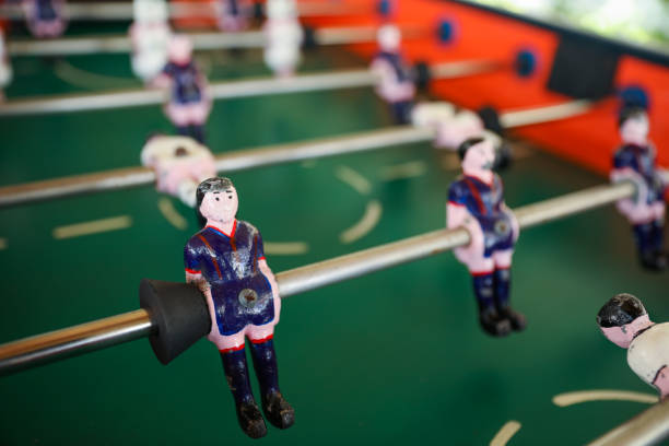 istock A foosball table is a recreational game symbolizing entertainment, skill, and socializing. It represents teamwork, competition, and the joy of play, and is often associated with bar and culture 1483731017