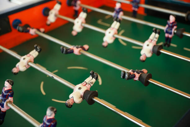 istock A foosball table is a recreational game symbolizing entertainment, skill, and socializing. It represents teamwork, competition, and the joy of play, and is often associated with bar and culture 1483731018