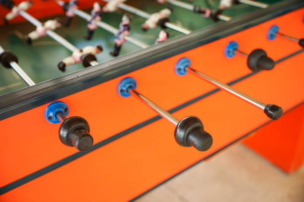 istock A foosball table is a recreational game symbolizing entertainment, skill, and socializing. It represents teamwork, competition, and the joy of play, and is often associated with bar and culture 1483731062