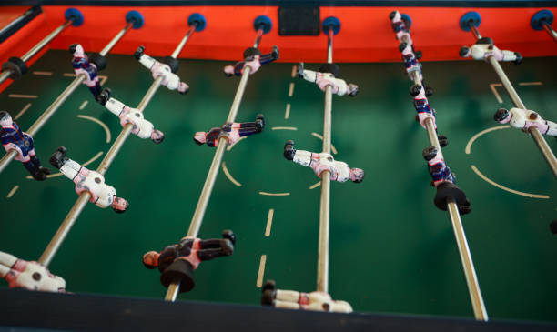 istock A foosball table is a recreational game symbolizing entertainment, skill, and socializing. It represents teamwork, competition, and the joy of play, and is often associated with bar and culture 1483731078