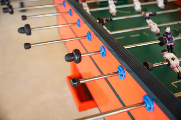 istock A foosball table is a recreational game symbolizing entertainment, skill, and socializing. It represents teamwork, competition, and the joy of play, and is often associated with bar and culture 1483731079