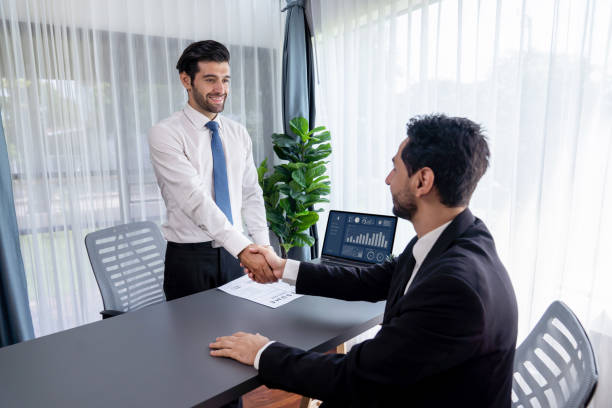istock Successful job interview at business office with handshake. Fervent 1483738497