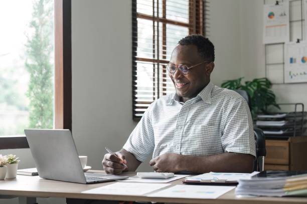 istock African American man calculating using machine managing household finances at home, focused biracial male make calculations on calculator account taxes or expenses 1483739775