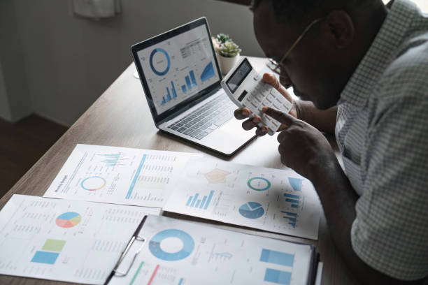 istock African American man calculating using machine managing household finances at home, focused biracial male make calculations on calculator account taxes or expenses 1483739890