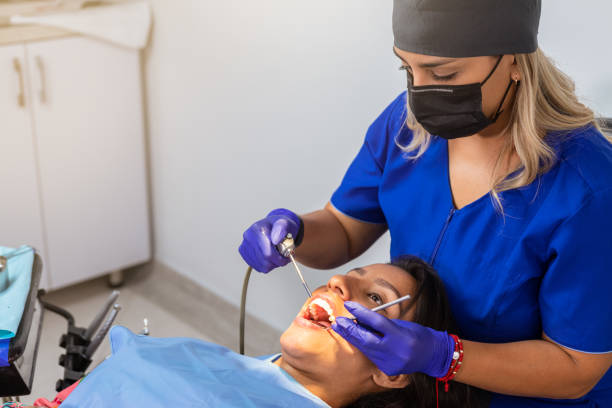 istock Expert dental care: Female dentist treating patient with professional instruments 1483742308