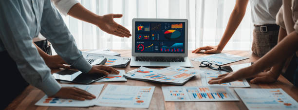 istock Analyst team utilizing BI Fintech to analyze financial dashboard. Scrutinize 1483743579