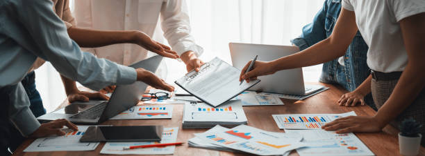 istock Analyst team utilizing BI Fintech to analyze financial dashboard. Scrutinize 1483743967