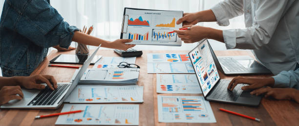 istock Analyst team utilizing BI Fintech to analyze financial report. Scrutinize 1483744244