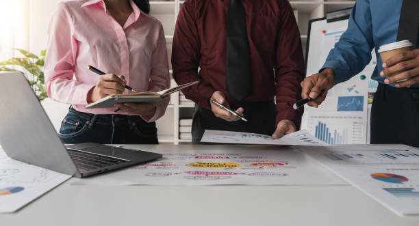 istock Intelligence analysis concept, group of business people brainstorm discussing current finance and economy on company investment laptop at meeting 1483744945