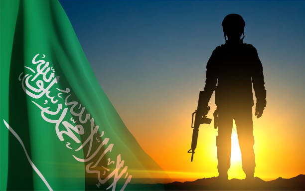 istock Silhouette of a soldier against the sunset sky and Saudi Arabia flag 1483745164