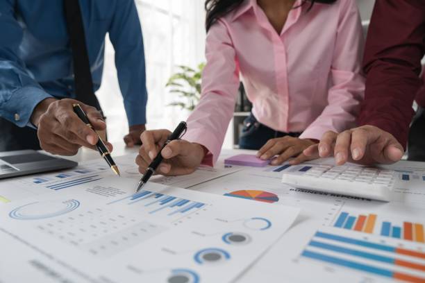 istock Intelligence analysis concept, group of business people brainstorm discussing current finance and economy on company investment laptop at meeting 1483745340