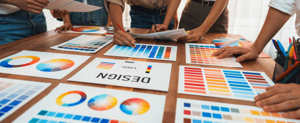 istock Graphic designer brainstorming logo and graphic arts at workshop. Scrutinize 1483745420