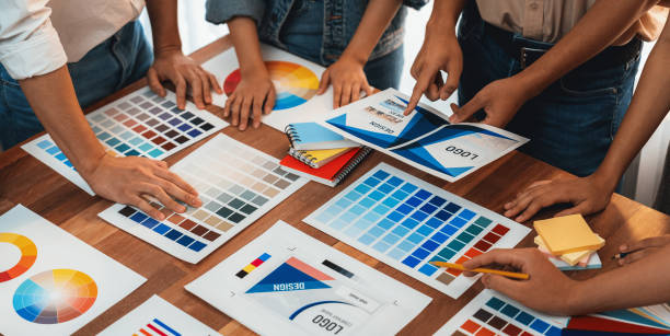 istock Graphic designer brainstorming logo and graphic arts at workshop. Scrutinize 1483745528