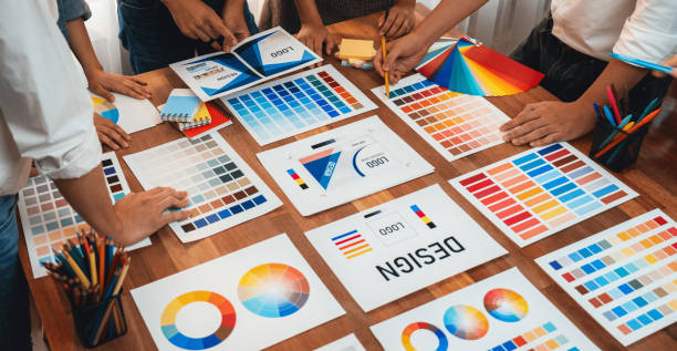 istock Graphic designer brainstorming logo and graphic arts at workshop. Scrutinize 1483745561