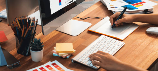 istock Graphic designer works on computer laptop with digital pen. Scrutinize 1483745742