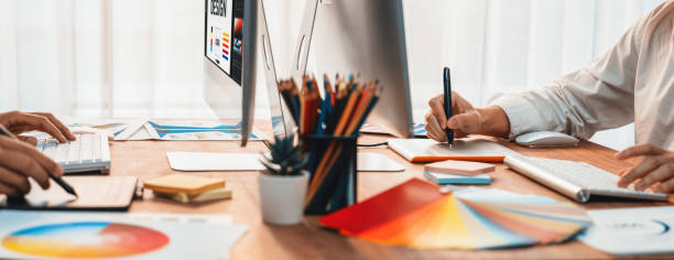 istock Graphic designer works on computer laptop with digital pen. Scrutinize 1483746640