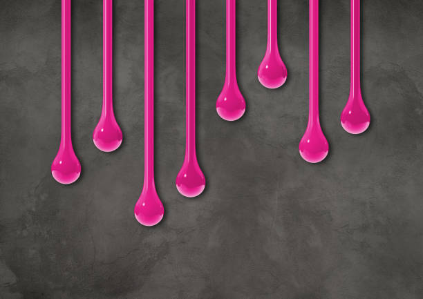 istock Pink ink drops on dark concrete wall. Horizontal wallpaper 1483750916