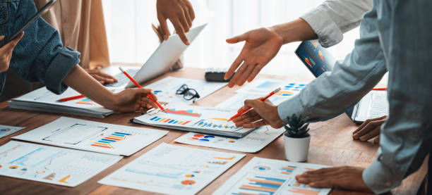 istock Analyst team utilizing BI Fintech to analyze financial dashboard. Scrutinize 1483751632