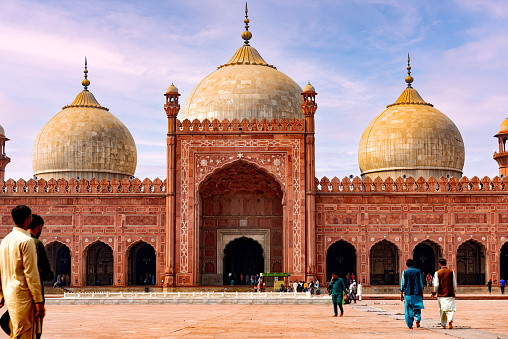Built in 1671, Badshahi Mosque is the crown jewel of Lahore, a symbol of the Mughal Empire (1526-1857), and one of the most beautiful places in Pakistan. Its architecture is characterized by carved red sandstones, which was typical of the Mughal era.\n\nThe vast courtyard of the mosque can hold up to 100,000 worshippers, making it the second largest mosque in Pakistan! I recommend spending at least a couple of hours here to admire all the marvelous details of the architecture.