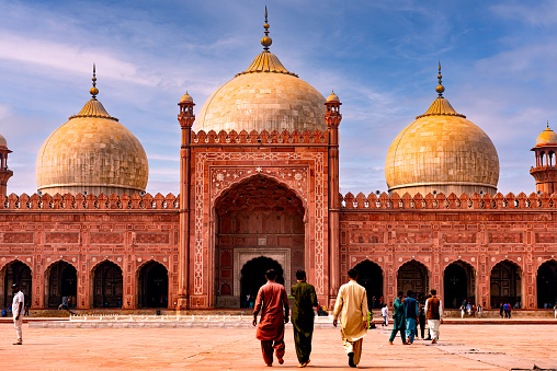 Built in 1671, Badshahi Mosque is the crown jewel of Lahore, a symbol of the Mughal Empire (1526-1857), and one of the most beautiful places in Pakistan. Its architecture is characterized by carved red sandstones, which was typical of the Mughal era.\n\nThe vast courtyard of the mosque can hold up to 100,000 worshippers, making it the second largest mosque in Pakistan! I recommend spending at least a couple of hours here to admire all the marvelous details of the architecture.