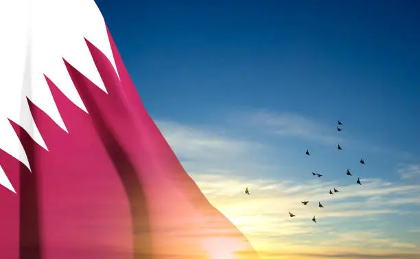 Vector illustration of Qatar flag in the blue sky. Patriotic background