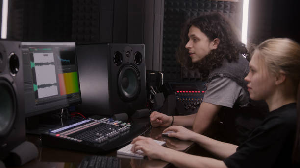 istock Female audio engineer and musician create song in DAW software 1483754579
