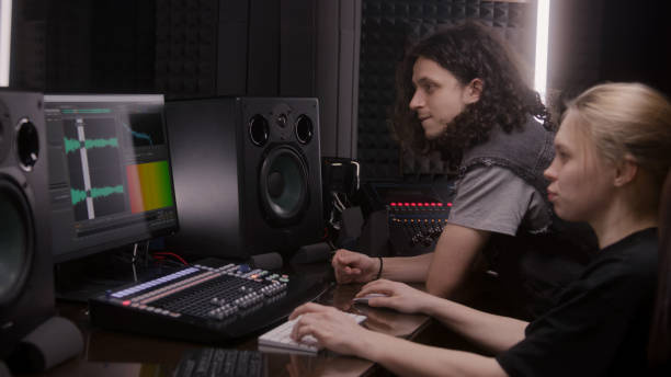 istock Female audio engineer and musician create song in DAW software 1483754627