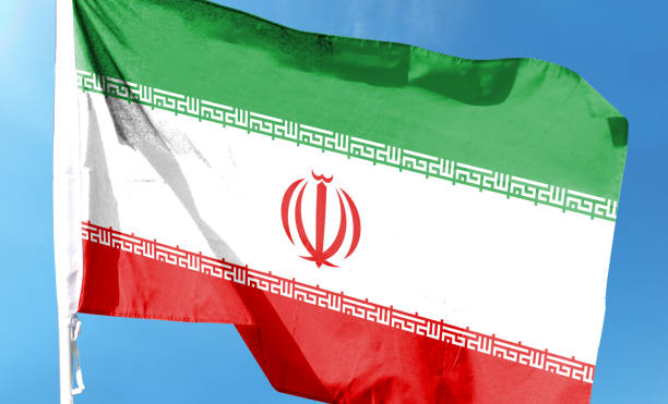 istock Iran flag in cloudy sky. waving in the sky 1483757622