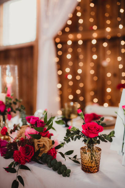istock Side view of a wedding reception table with candles and flowers 1483757648