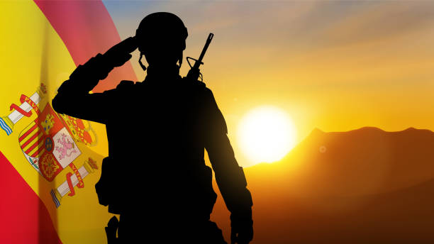 istock Silhouette of a saluting soldier with Spain flag against the sunset 1483761154