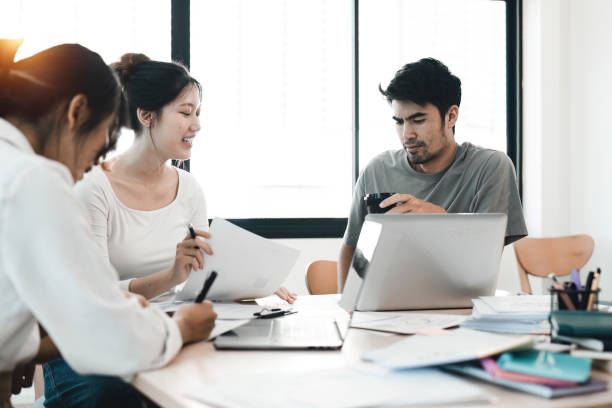 istock Diverse colleagues working on project together. Diverse Team of Creative Professionals Talk, Brainstorms 1483761555